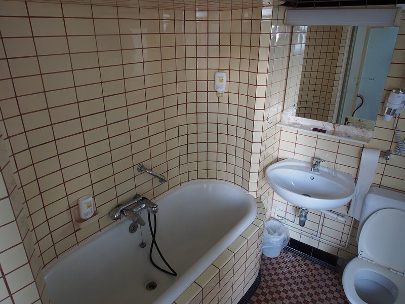 Bathroom with tiled walls and flooring