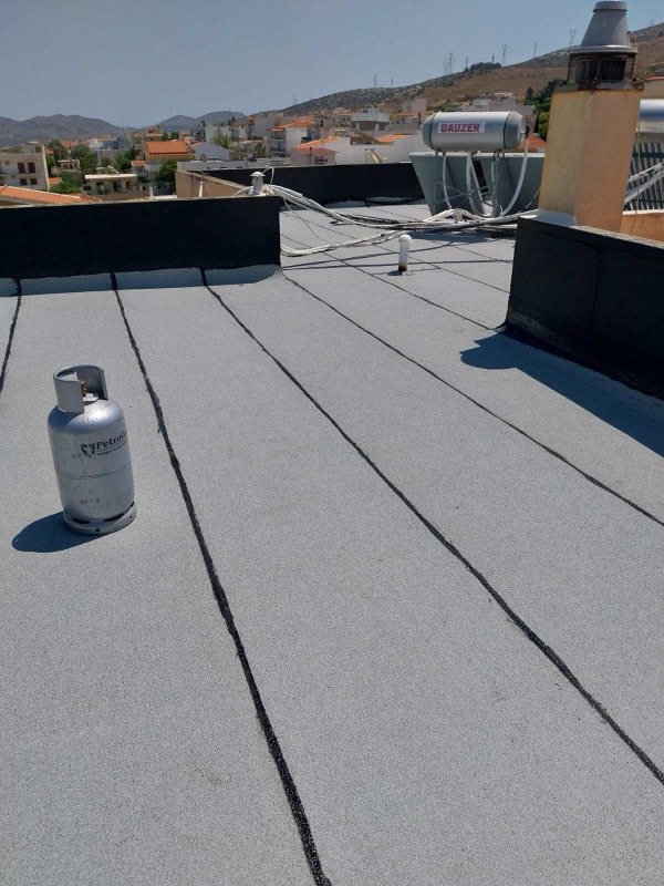 Waterproofing coating being applied to a flat roof terrace